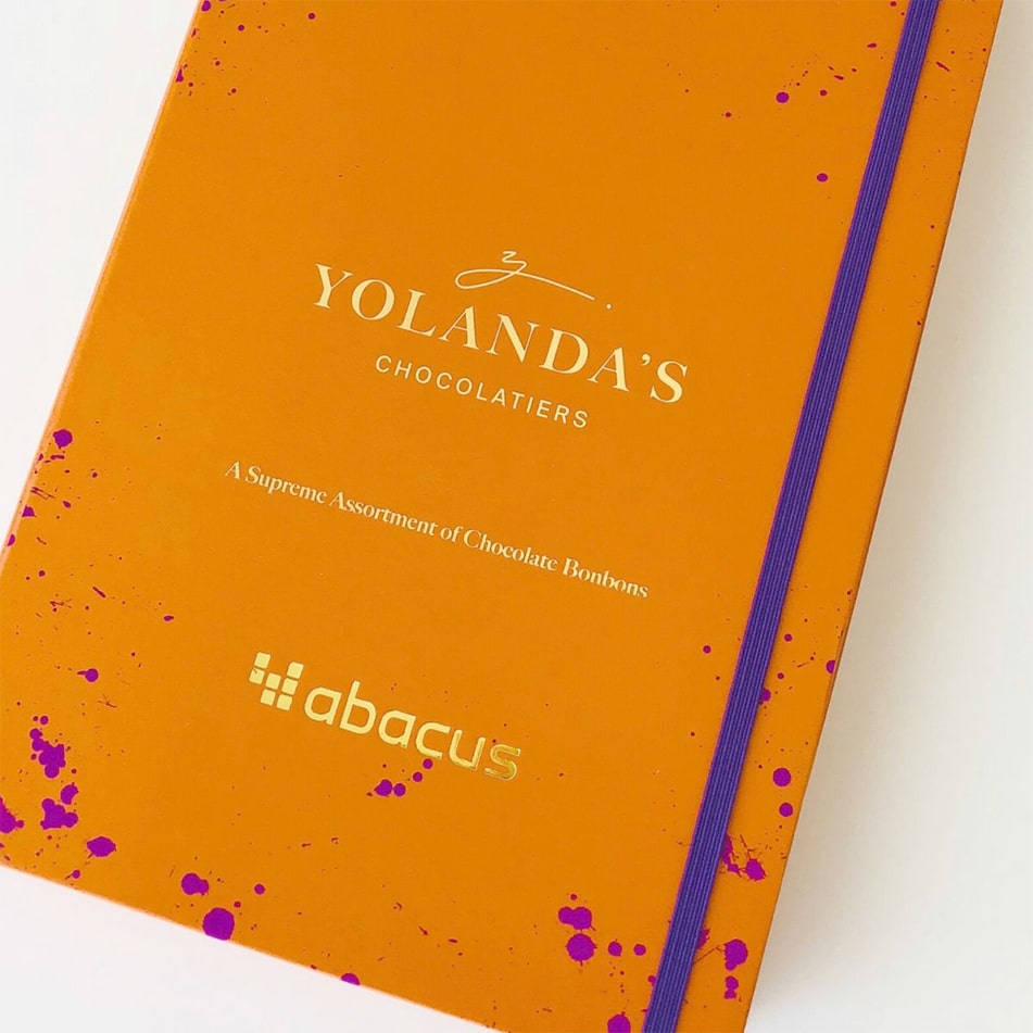 Corporate chocolate box with a gold-foil company logo